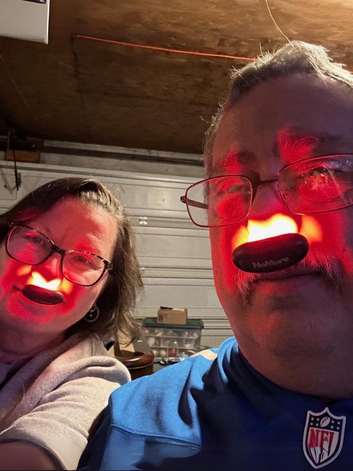 Kevin Lannoo and his wife using NoMore® Colds red light devices in their noses, review about buying for family at Christmas and feeling sinus relief in 10 minutes while hoping it helps allergies
