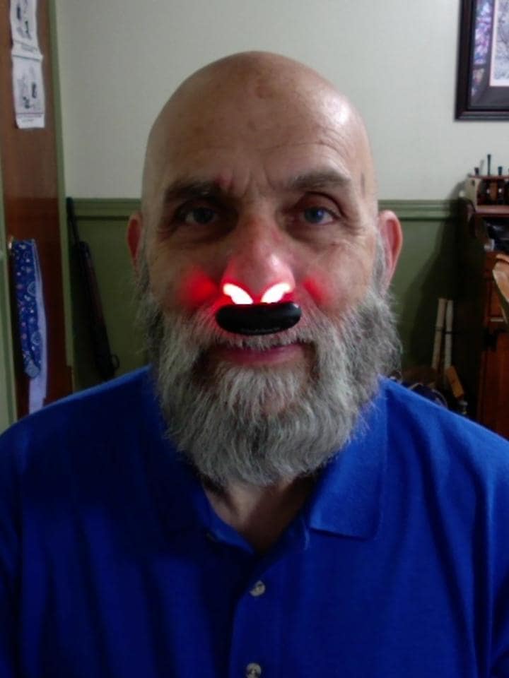 Retired physician Robert Amitrano using NoMore® Colds red light therapy device in his nose, review about relief from post-nasal drip, buying more for wife and son, and recommending for winter colds